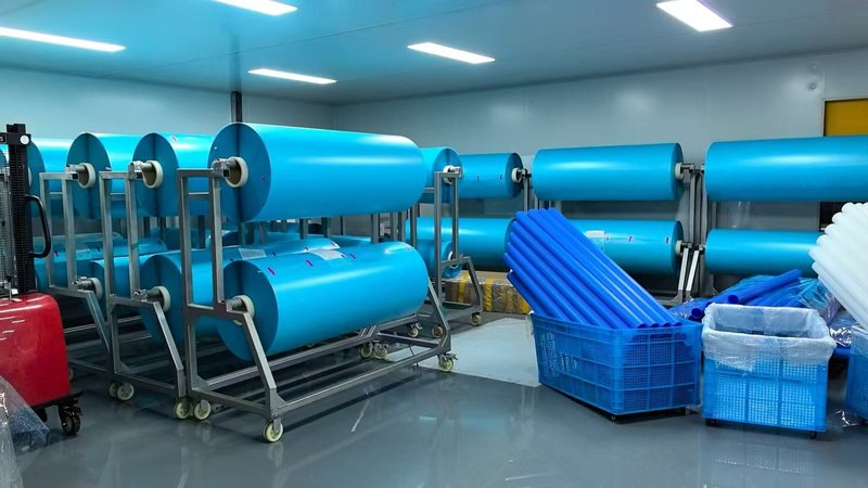 bulk window tint rolls warehouse Bulk window tint rolls stored on warehouse racks for wholesale orders