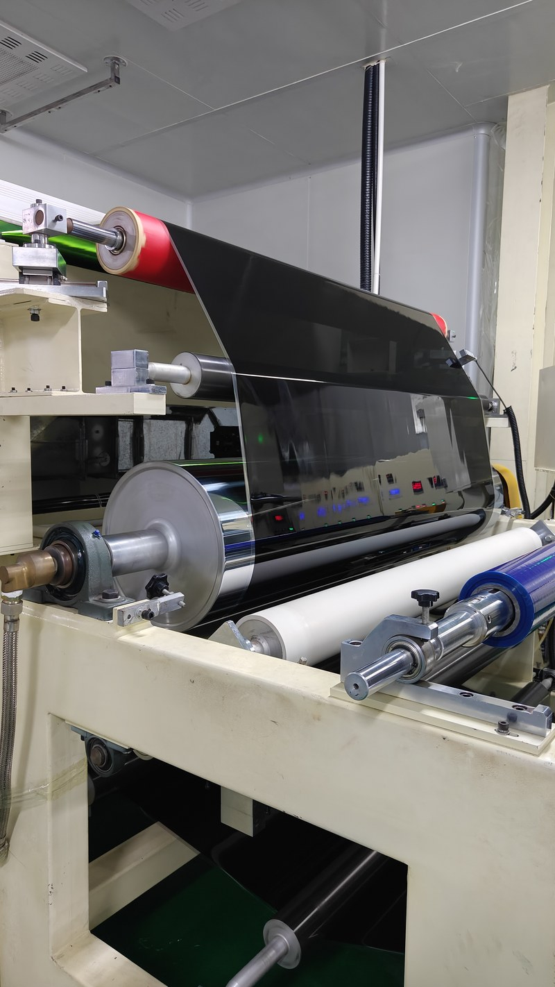 dark ceramic window tint film running through the coating line at the KSB factory in Guangzhou