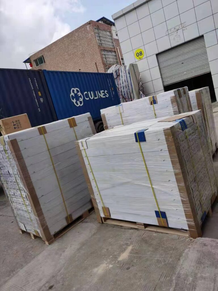 Pallets of window film cartons loaded into a shipping container for a 300-roll export order