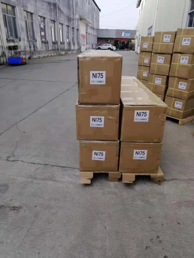 White label window film cartons with custom labels stacked on pallets in the factory warehouse