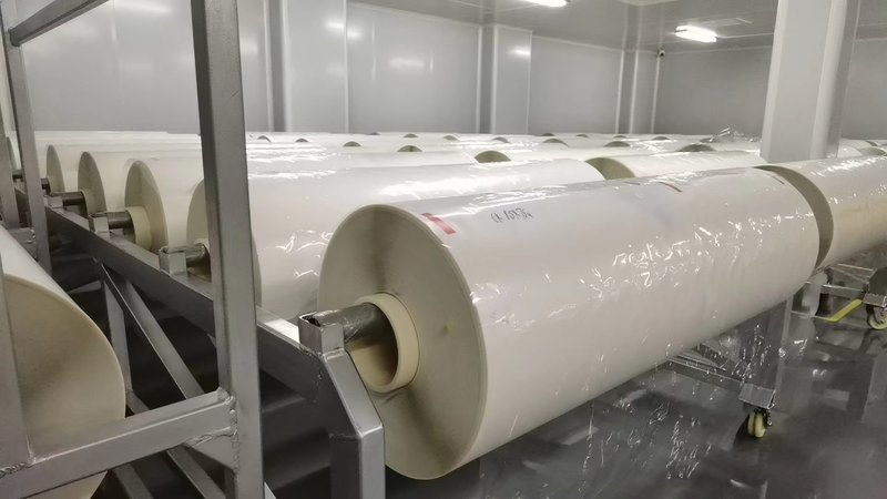 PET base film rolls stored in a cleanroom before window film lamination
